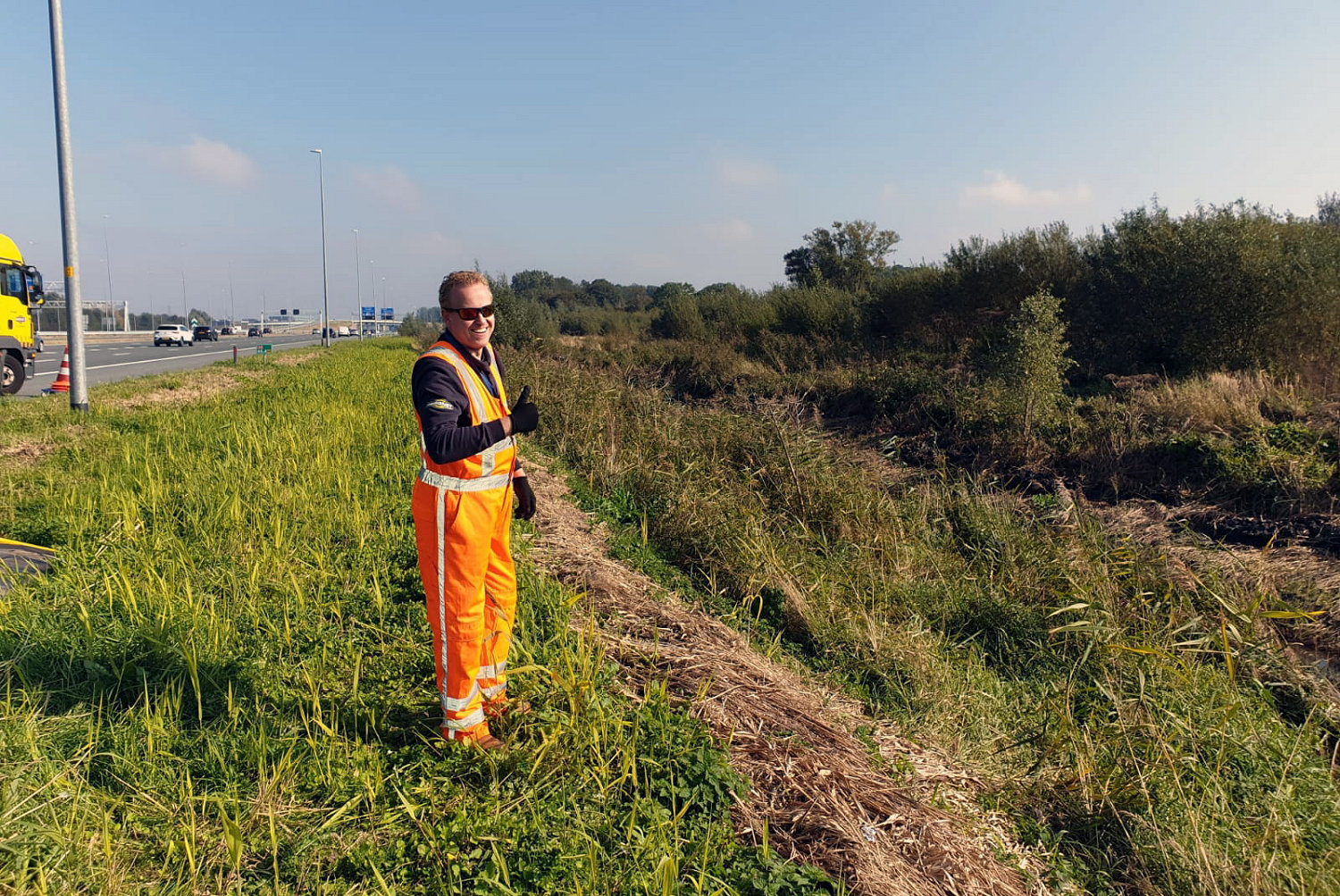 Bjorn Schipper of Bergnet recovering a car from a drainage ditch next to the A6 at Almere on 9 October 2021