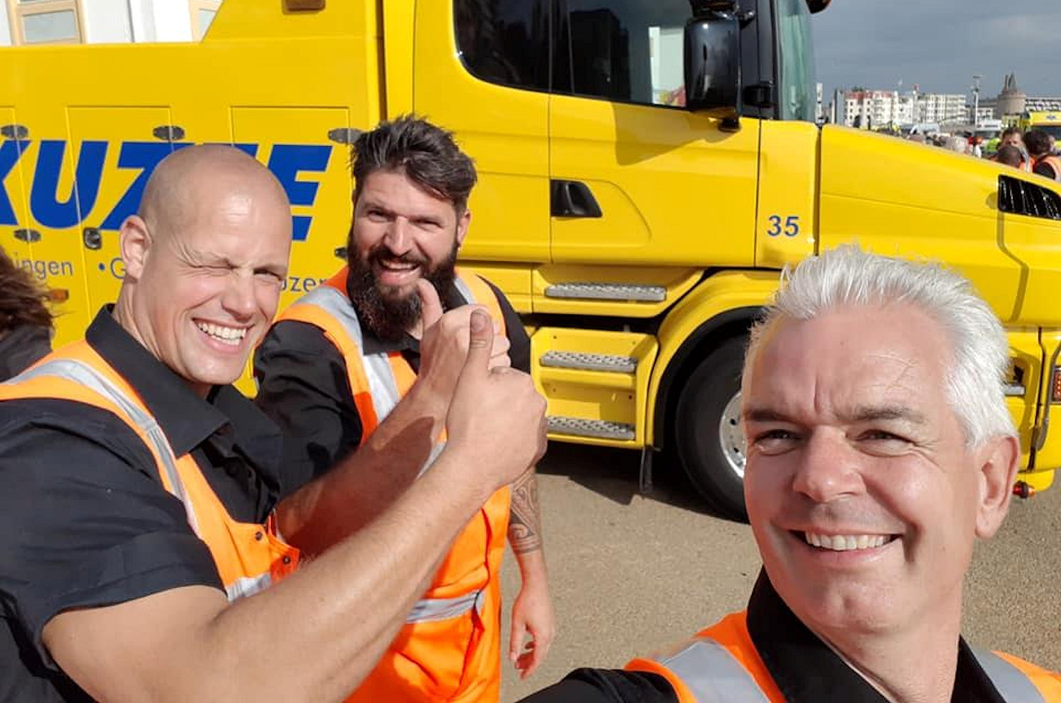 Yoran van der Haar, Mark Ravestein and Mark Kuzee, all from Auto Kuzee, on the promenade in Flushing on 15 August 2018